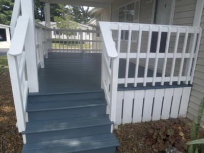 Exterior porch/ wooden Pressured wash, striped, primed and painted. - After