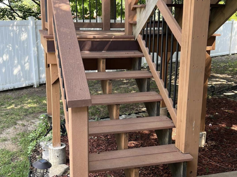 Large deck with stairs and spindles. - Before