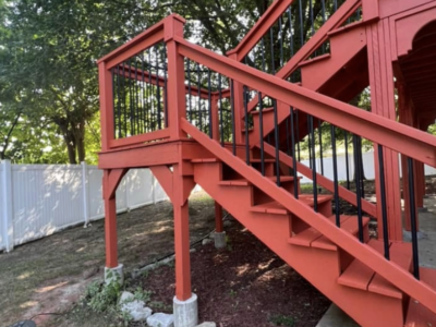 Large deck with stairs and spindles. - After