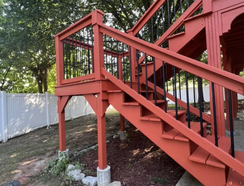 Large deck with stairs and spindles. - After
